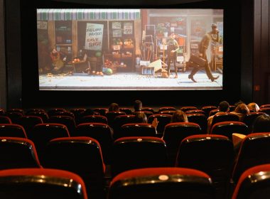cartoon movie showing on theater screen
